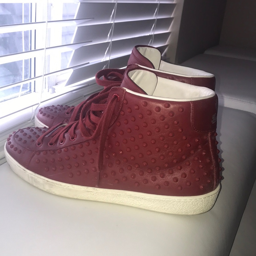 A fairly used Gucci spike sneakers.